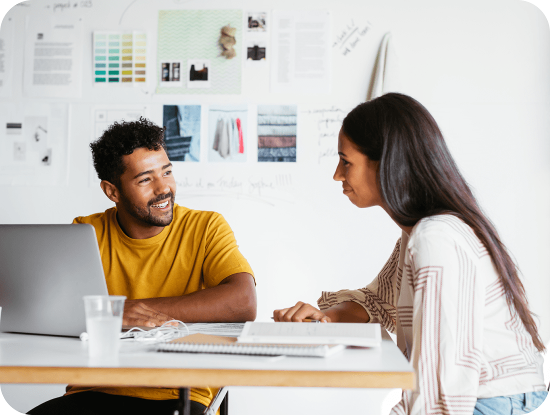 A photo of a man and a woman sat down having a conversation